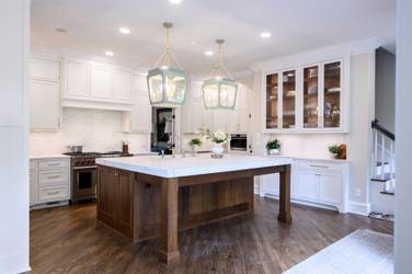 Two-tone kitchen with walnut island and white cabinetry in Cary, NC