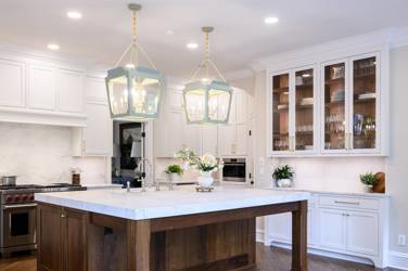 Two-tone kitchen with walnut island and white cabinetry in Cary, NC