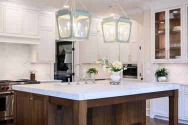 Two-tone kitchen with walnut island and white cabinetry in Cary, NC