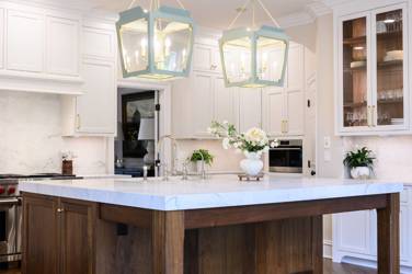 Two-tone kitchen with walnut island and white cabinetry in Cary, NC