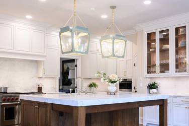 Two-tone kitchen with walnut island and white cabinetry in Cary, NC