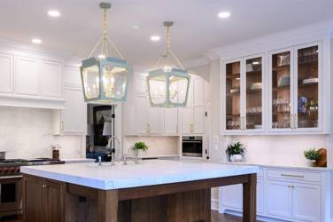 Two-tone kitchen with walnut island and white cabinetry in Cary, NC