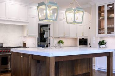 Two-tone kitchen with walnut island and white cabinetry in Cary, NC
