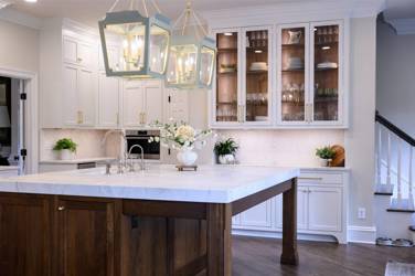 Two-tone kitchen with walnut island and white cabinetry in Cary, NC