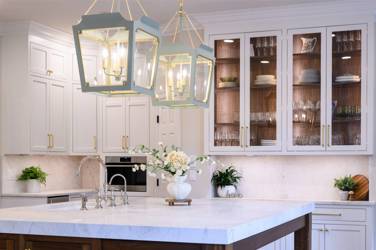Two-tone kitchen with walnut island and white cabinetry in Cary, NC