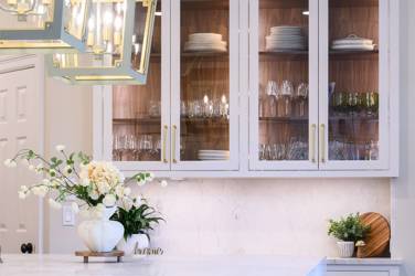 Two-tone kitchen with walnut island and white cabinetry in Cary, NC