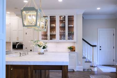 Two-tone kitchen with walnut island and white cabinetry in Cary, NC
