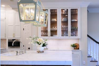 Two-tone kitchen with walnut island and white cabinetry in Cary, NC