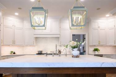 Two-tone kitchen with walnut island and white cabinetry in Cary, NC