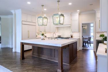 Two-tone kitchen with walnut island and white cabinetry in Cary, NC