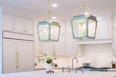 Two-tone kitchen with walnut island and white cabinetry in Cary, NC