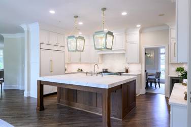 Two-tone kitchen with walnut island and white cabinetry in Cary, NC