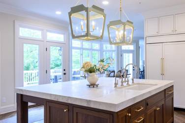 Two-tone kitchen with walnut island and white cabinetry in Cary, NC