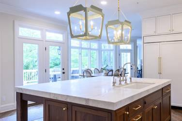 Two-tone kitchen with walnut island and white cabinetry in Cary, NC