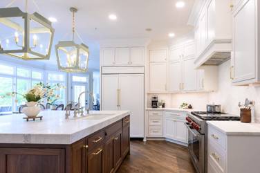 Two-tone kitchen with walnut island and white cabinetry in Cary, NC