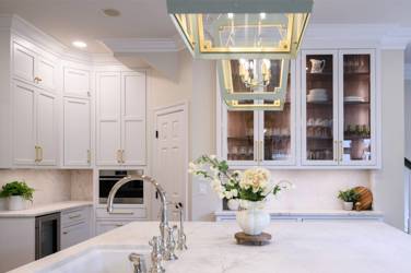 Two-tone kitchen with walnut island and white cabinetry in Cary, NC