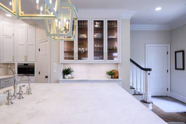 Two-tone kitchen with walnut island and white cabinetry in Cary, NC