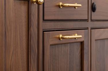 Two-tone kitchen with walnut island and white cabinetry in Cary, NC