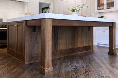 Two-tone kitchen with walnut island and white cabinetry in Cary, NC