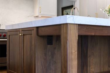 Two-tone kitchen with walnut island and white cabinetry in Cary, NC