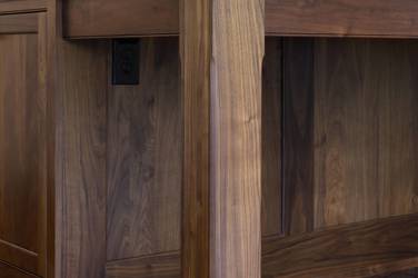 Two-tone kitchen with walnut island and white cabinetry in Cary, NC