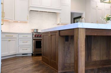 Two-tone kitchen with walnut island and white cabinetry in Cary, NC