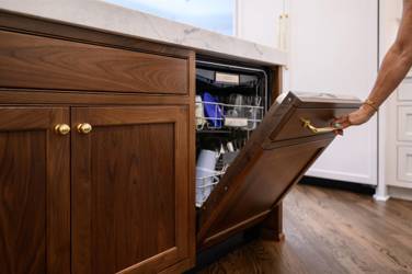 Two-tone kitchen with walnut island and white cabinetry in Cary, NC