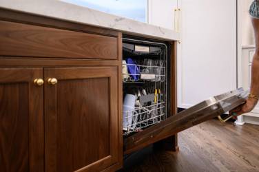 Two-tone kitchen with walnut island and white cabinetry in Cary, NC