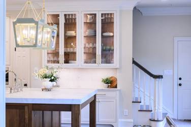 Two-tone kitchen with walnut island and white cabinetry in Cary, NC