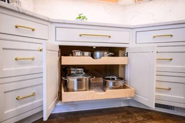 Two-tone kitchen with walnut island and white cabinetry in Cary, NC