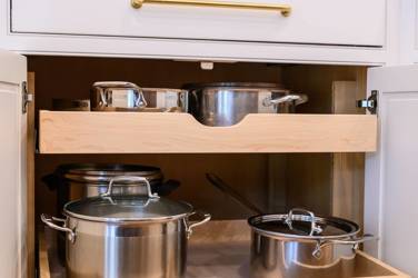 Two-tone kitchen with walnut island and white cabinetry in Cary, NC