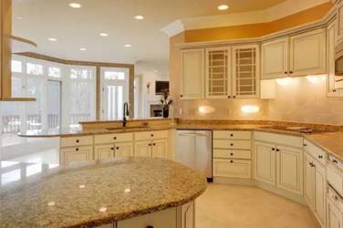 Two-tone kitchen with walnut island and white cabinetry in Cary, NC
