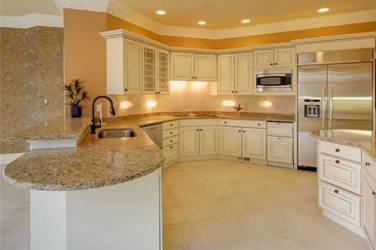 Two-tone kitchen with walnut island and white cabinetry in Cary, NC