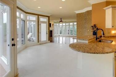 Two-tone kitchen with walnut island and white cabinetry in Cary, NC