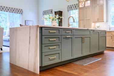 White oak kitchen with sage green island and white quartzite waterfall counters in Raleigh, NC