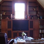Remodel a Bonus Room to a built-in entertainment center with Book cases